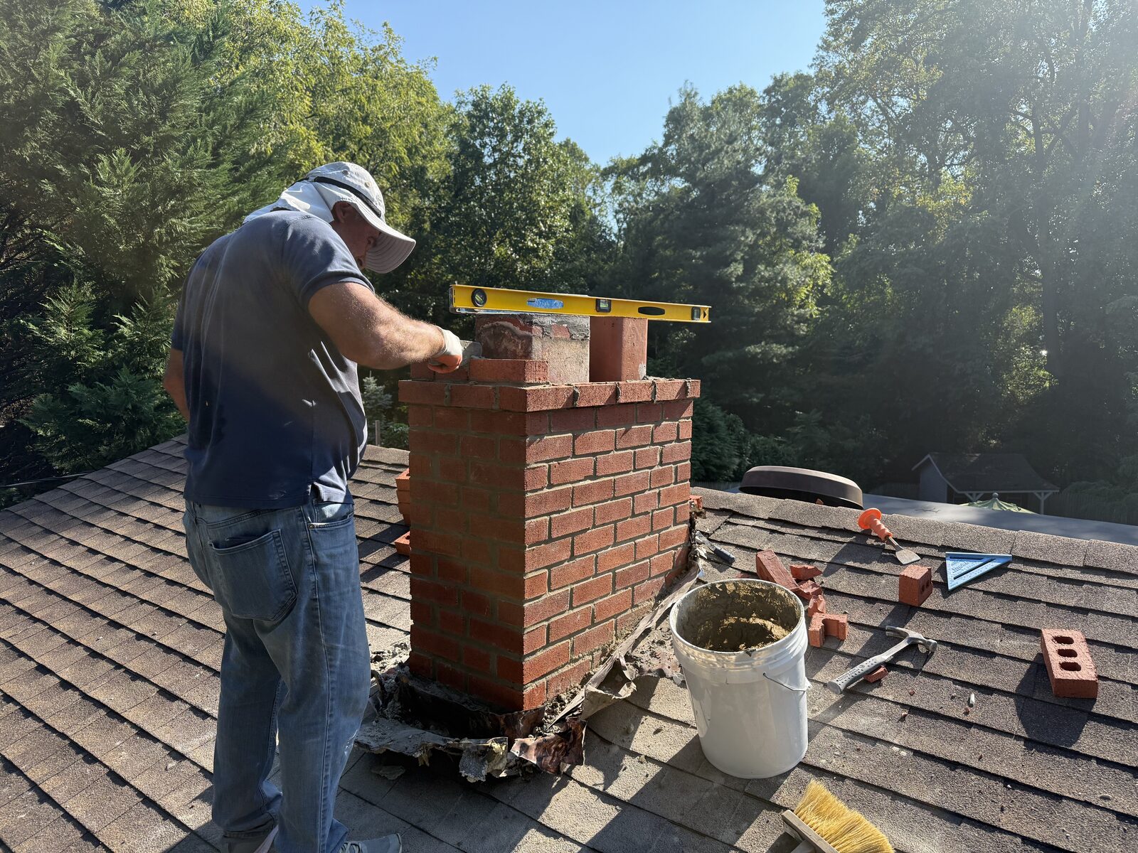 Best Choice GC crew rebuilding a brick chimney